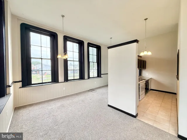 a view of an empty room with a window