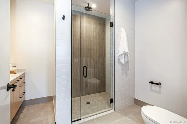 a bathroom with a shower and toilet