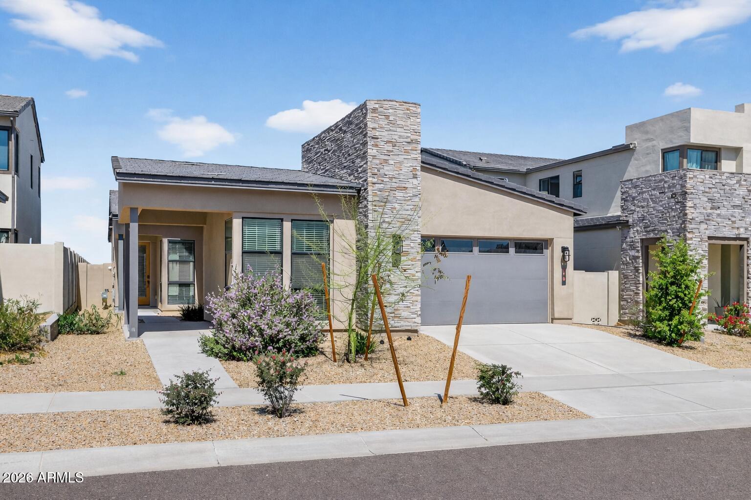 810 East Hopi Trail Phoenix, AZ 85042 - Photo 1 of 48 a front view of a house with garden