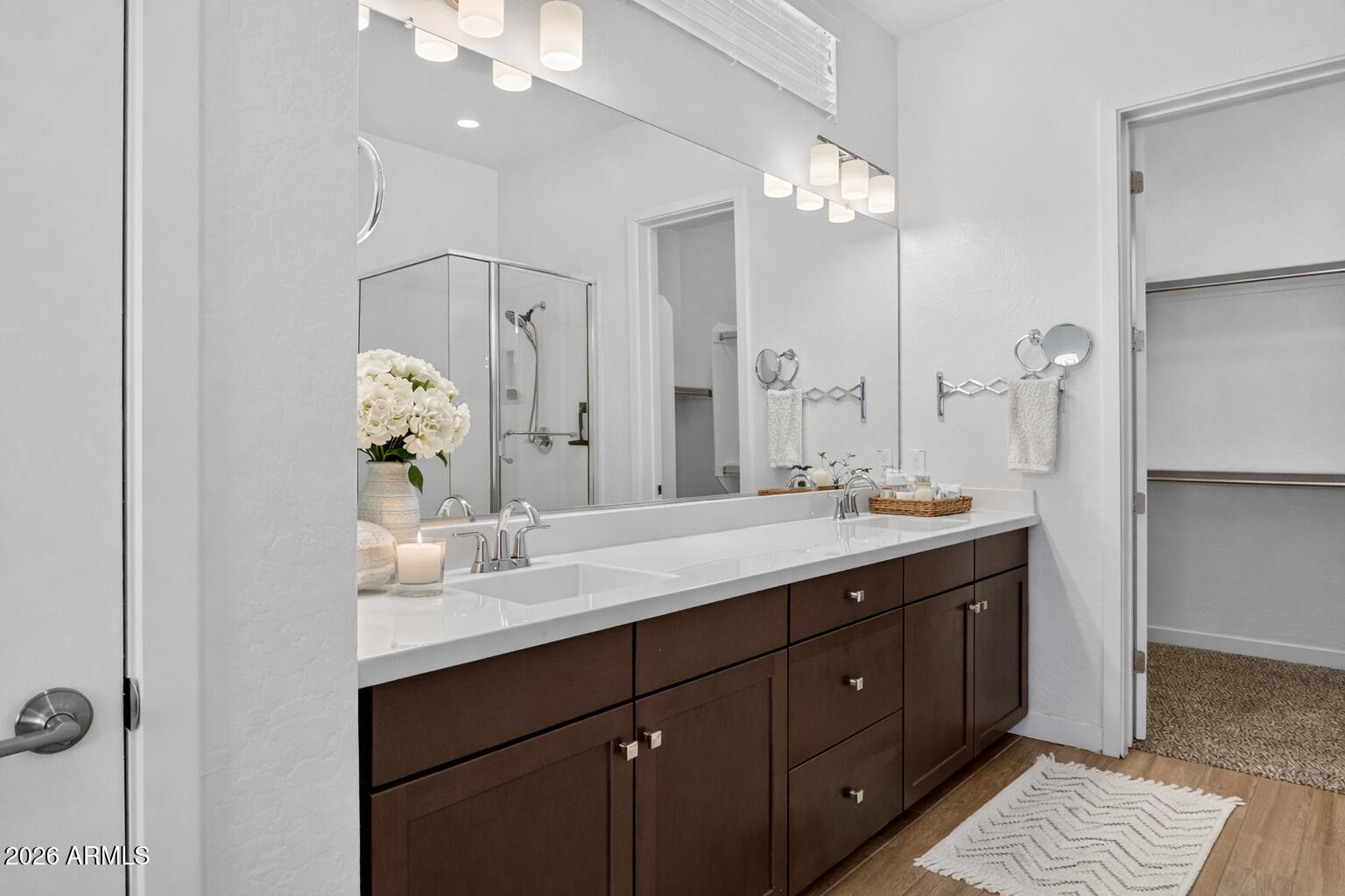 810 East Hopi Trail Phoenix, AZ 85042 - Photo 16 of 48 a bathroom with a double vanity sink and a mirror