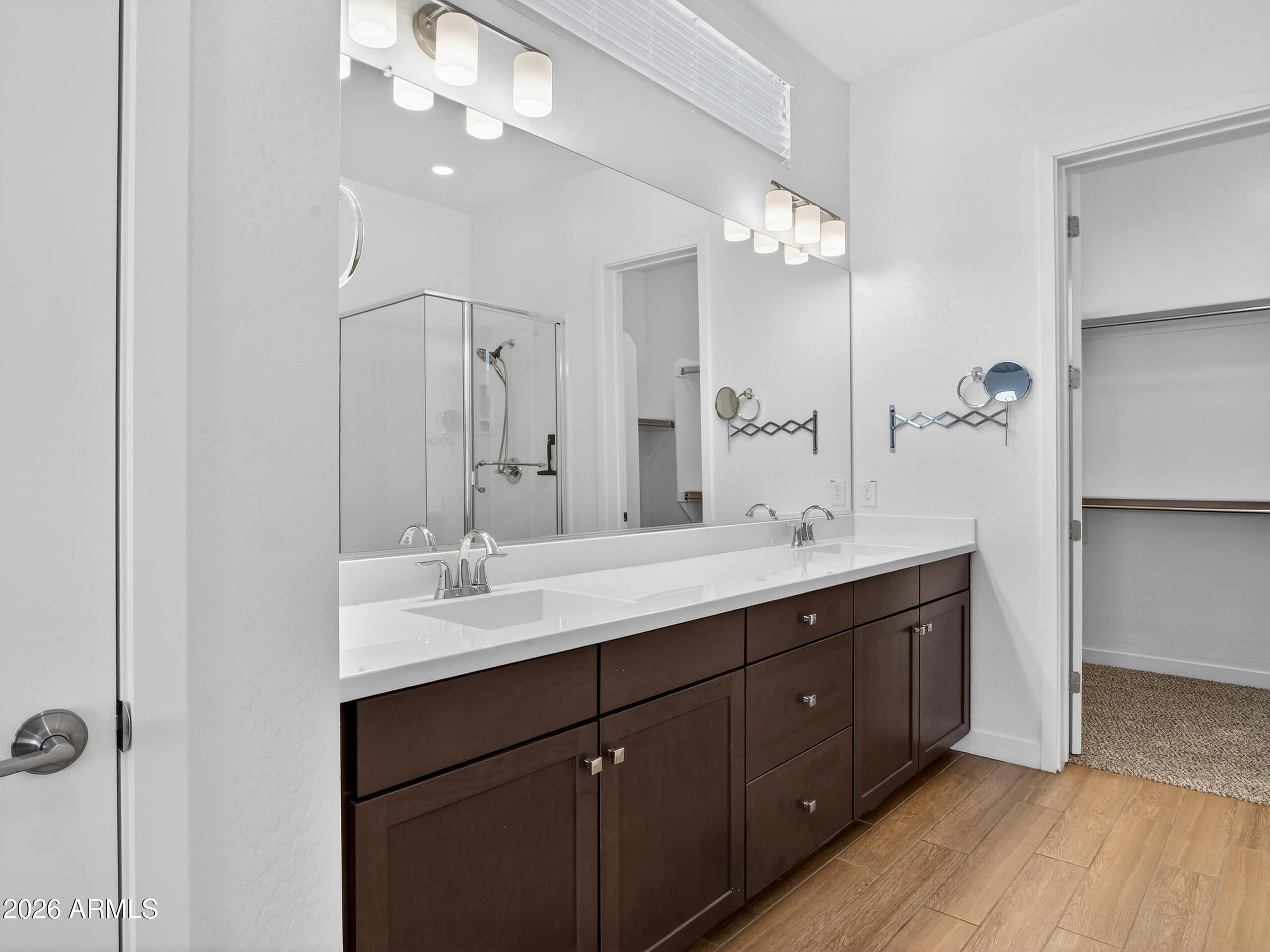 810 East Hopi Trail Phoenix, AZ 85042 - Photo 17 of 48 a bathroom with a double vanity sink a mirror and a shower