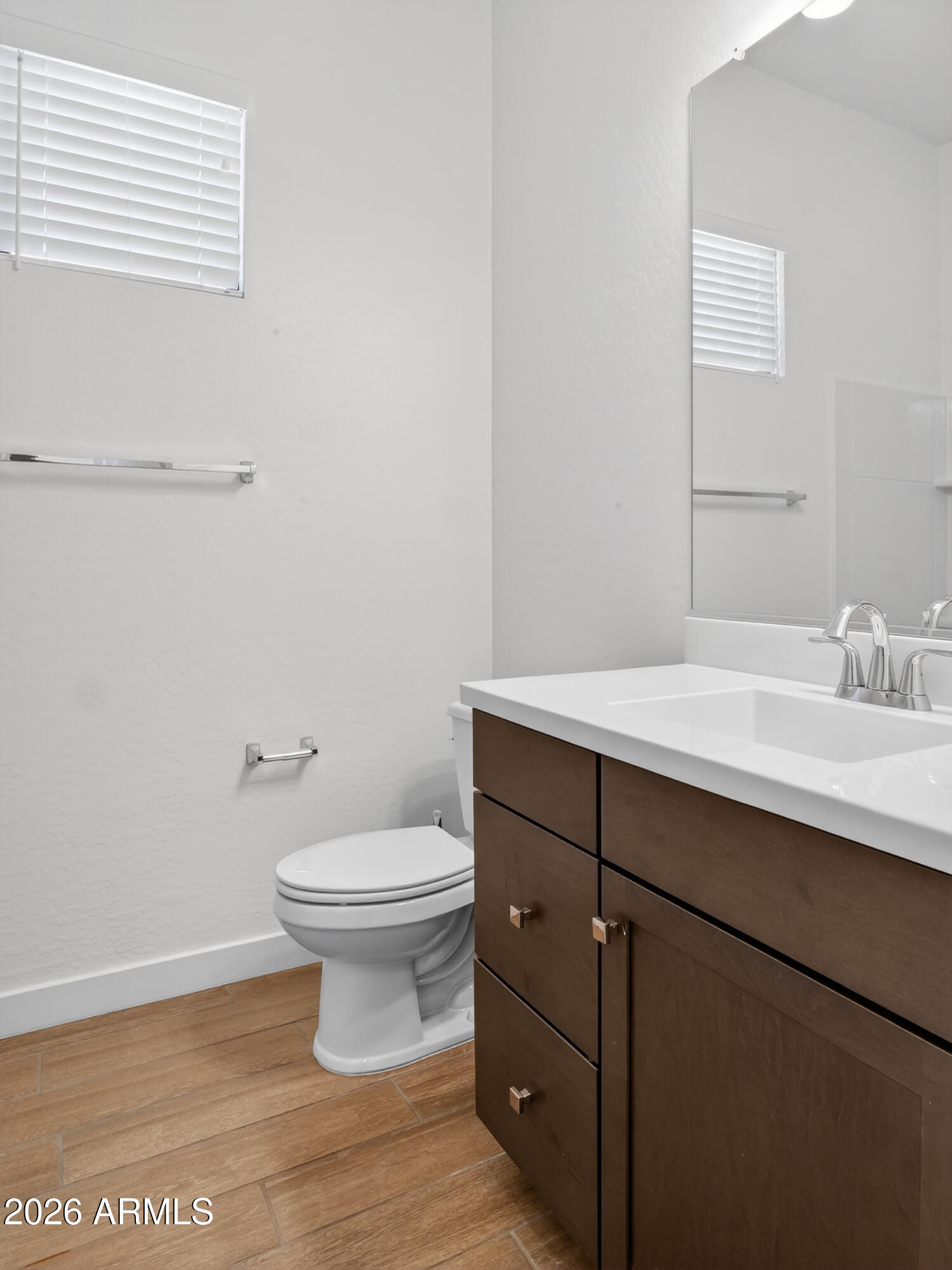 810 East Hopi Trail Phoenix, AZ 85042 - Photo 24 of 48 a bathroom with a sink a toilet and a mirror