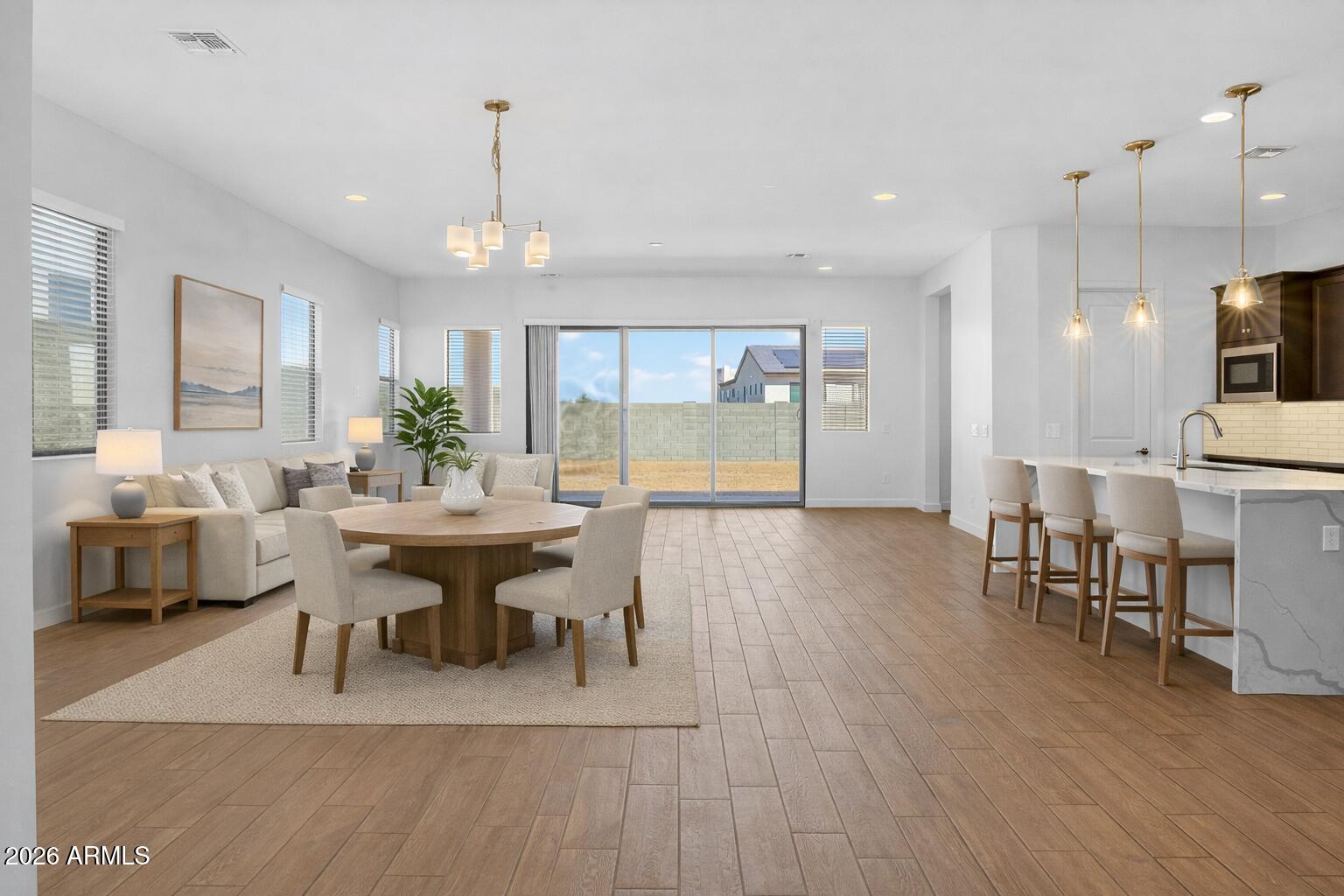810 East Hopi Trail Phoenix, AZ 85042 - Photo 3 of 48 a view of a dining room with furniture and wooden floor