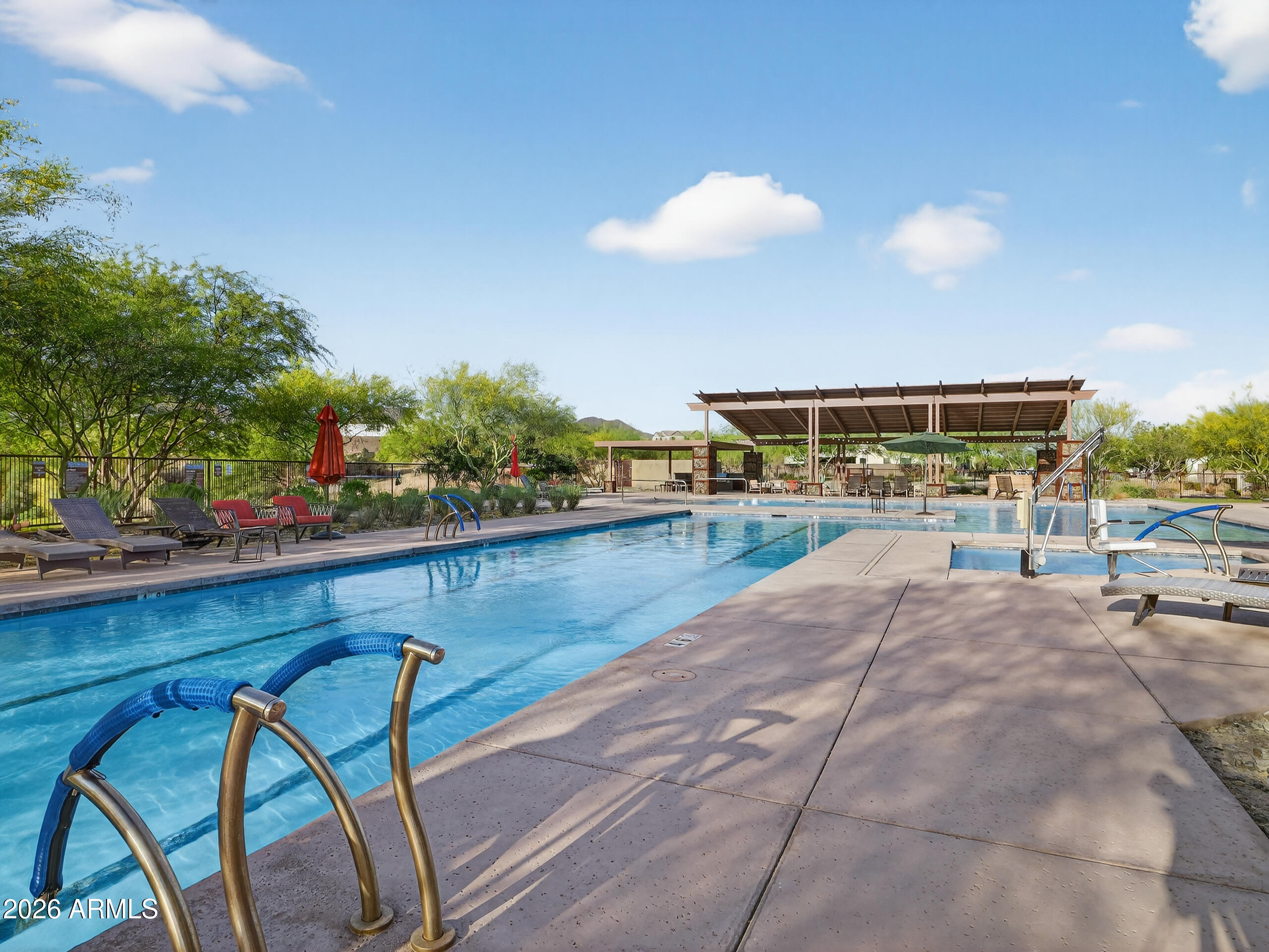 810 East Hopi Trail Phoenix, AZ 85042 - Photo 40 of 48 a view of a swimming pool with a patio and a backyard