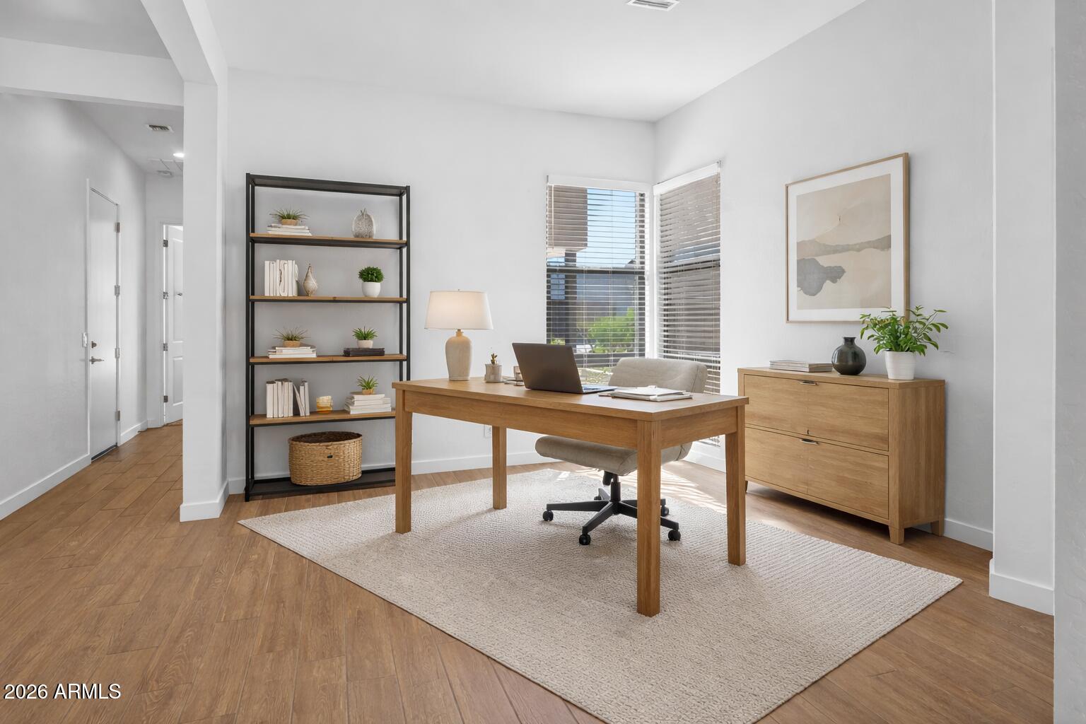 810 East Hopi Trail Phoenix, AZ 85042 - Photo 9 of 48 a workspace with furniture window and wooden floor