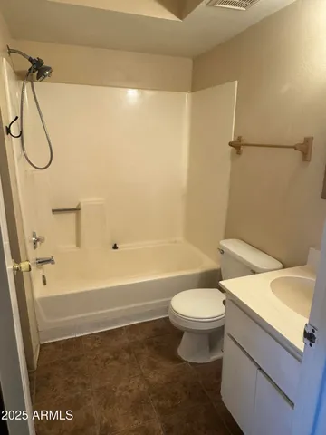a bathroom with a sink a toilet and a shower