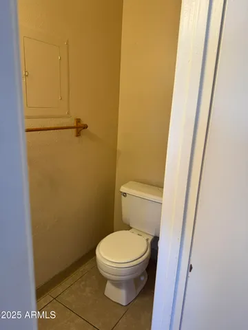 a white toilet sitting next to a sink