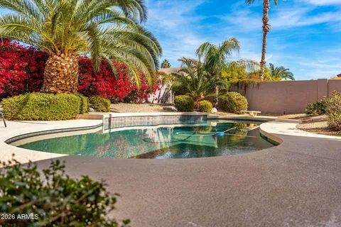 a view of swimming pool with a yard