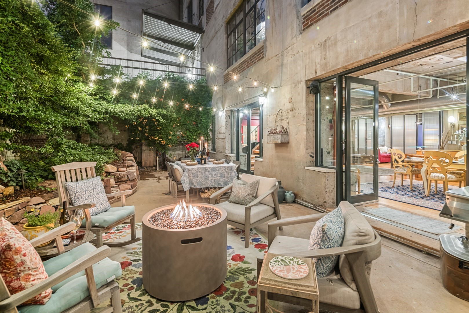 a view of a patio with dining table and chairs