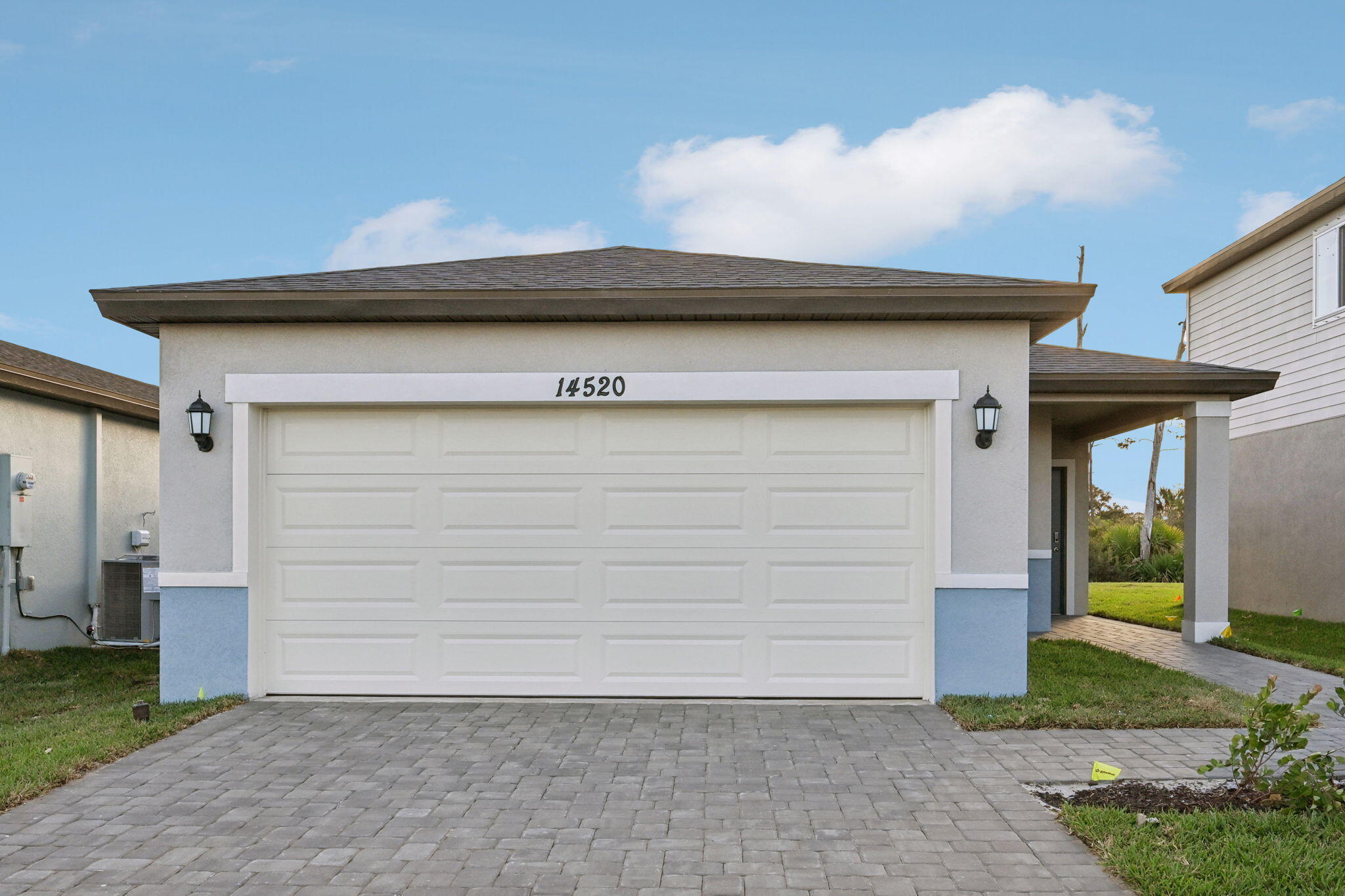 a view of house with garage