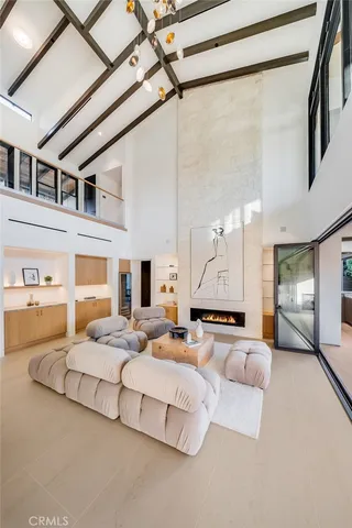 a bedroom with a large bed and a rug