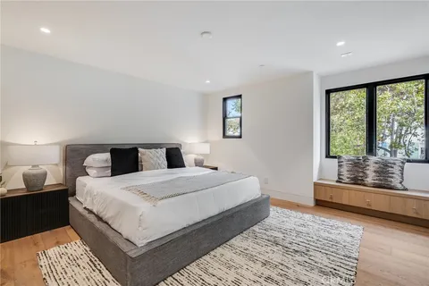 a bathroom with a sink a mirror and a toilet