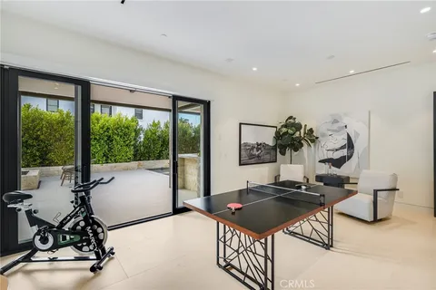 a bedroom with a large bed and a large window