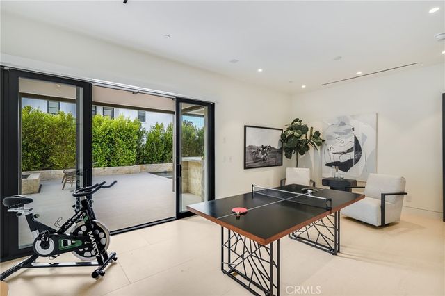 a bedroom with a large bed and a large window