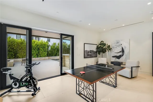 a bedroom with a large bed and a large window