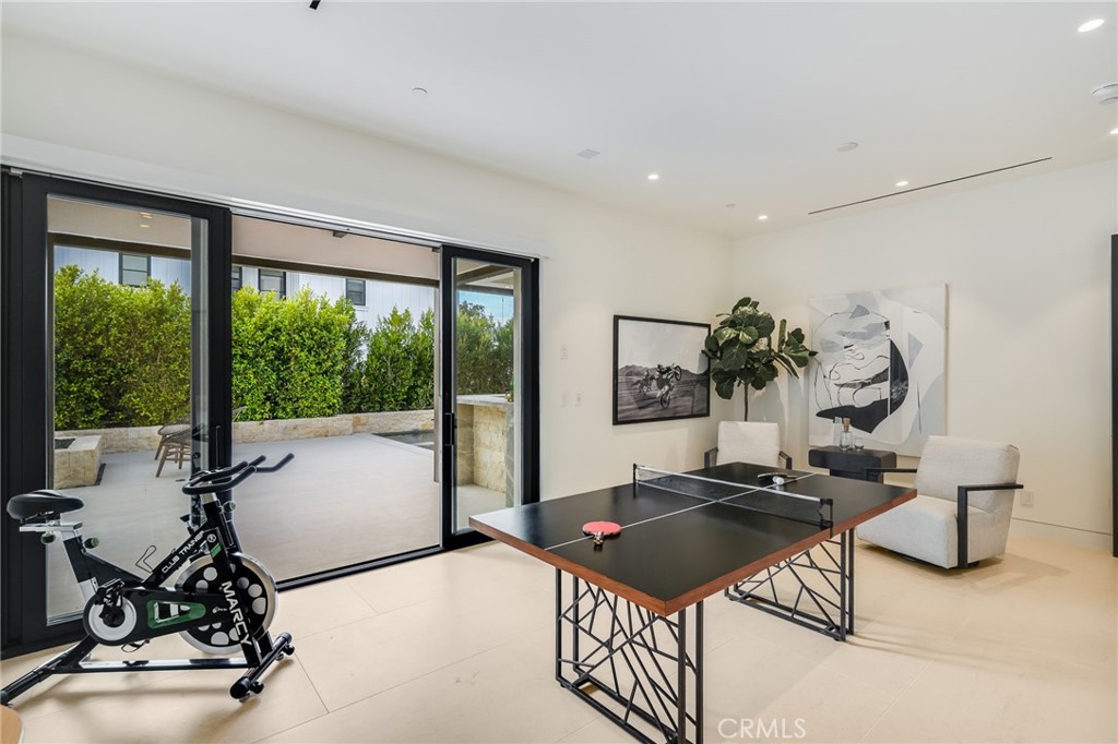 427 Santa Ana Avenue Newport Beach, CA 92663 - Photo 26 of 32 a living room with furniture a potted plant and a large window