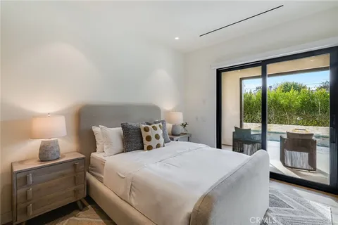 a view of swimming pool with a lounge chairs