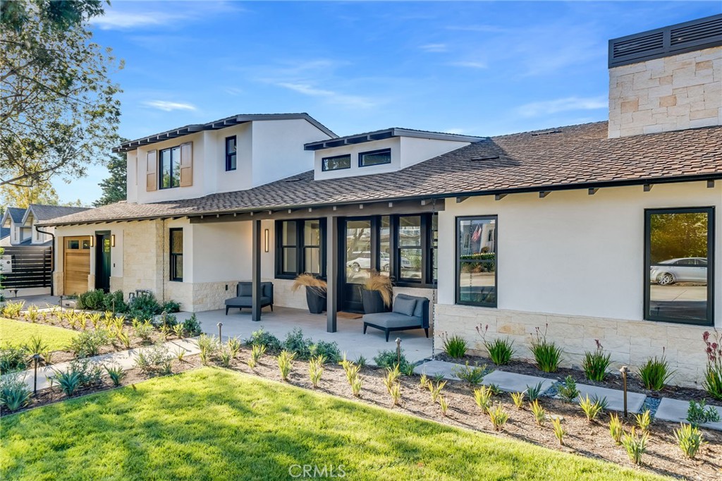 427 Santa Ana Avenue Newport Beach, CA 92663 - Photo 3 of 32 a front view of a house with swimming pool and furniture