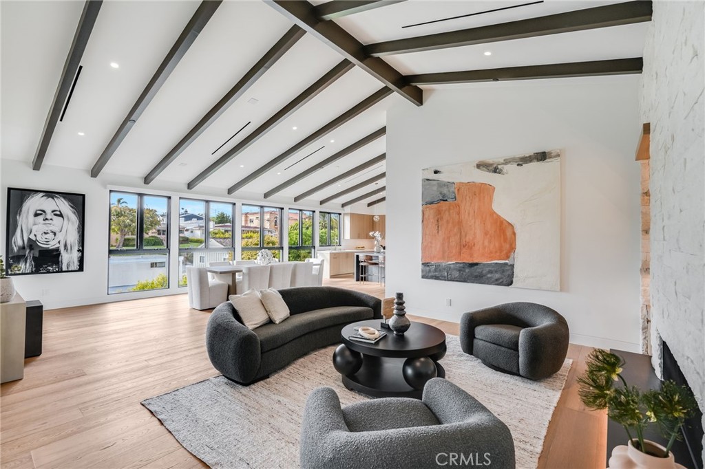 427 Santa Ana Avenue Newport Beach, CA 92663 - Photo 10 of 32 a living room with furniture and a large window