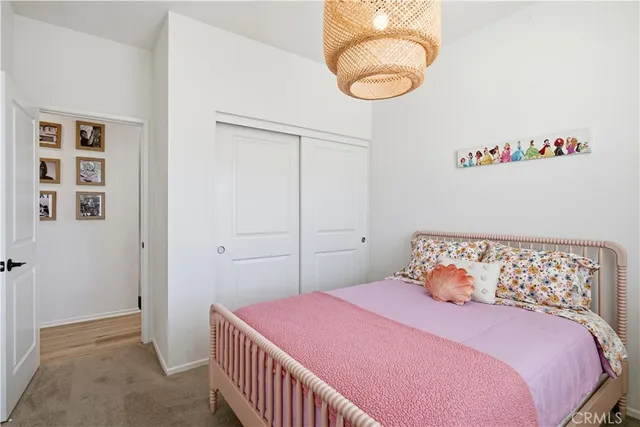 a bedroom with a bed and cabinets