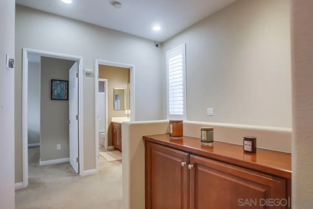 4115 Karst Road Carlsbad, CA 92010 - Photo 20 of 43 a bathroom with a sink and a mirror