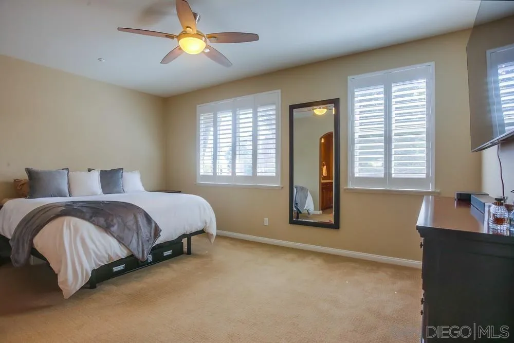 4115 Karst Road Carlsbad, CA 92010 - Photo 21 of 43 a bedroom with a bed and a lamp
