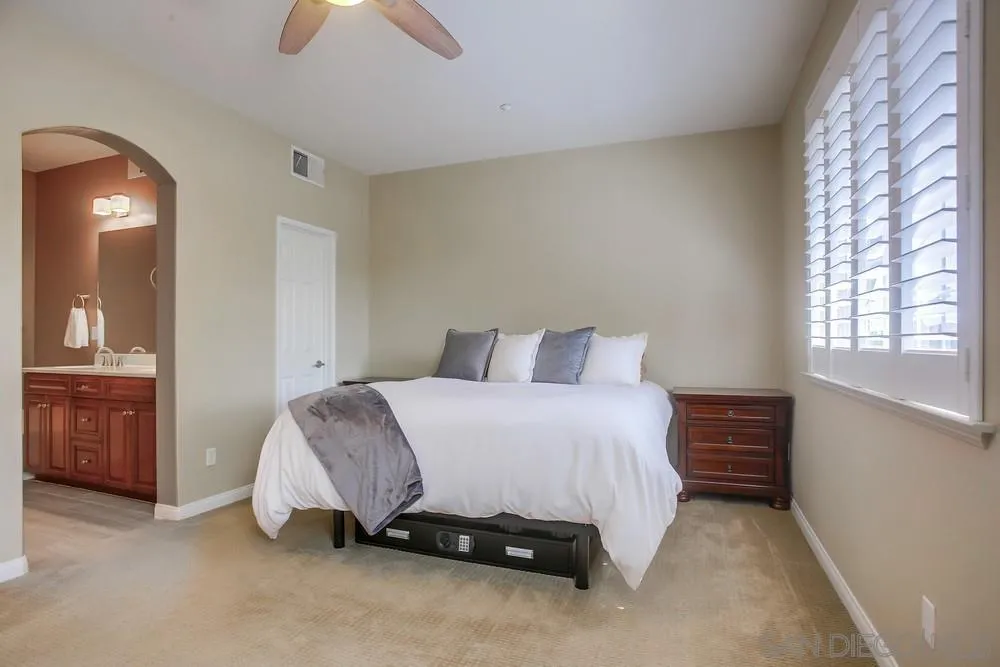 4115 Karst Road Carlsbad, CA 92010 - Photo 22 of 43 a bedroom with a bed and a lamp