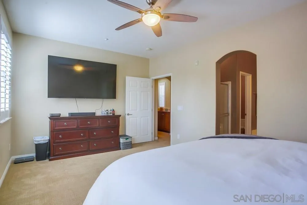 4115 Karst Road Carlsbad, CA 92010 - Photo 23 of 43 a bedroom with a bed and a flat screen tv