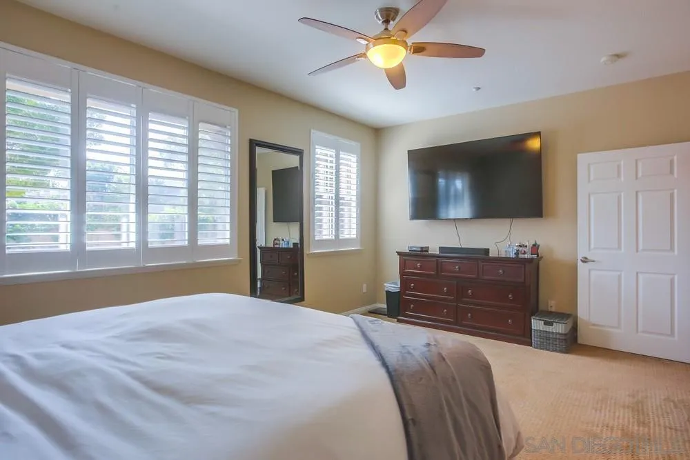 4115 Karst Road Carlsbad, CA 92010 - Photo 24 of 43 a bedroom with a bed and a flat screen tv
