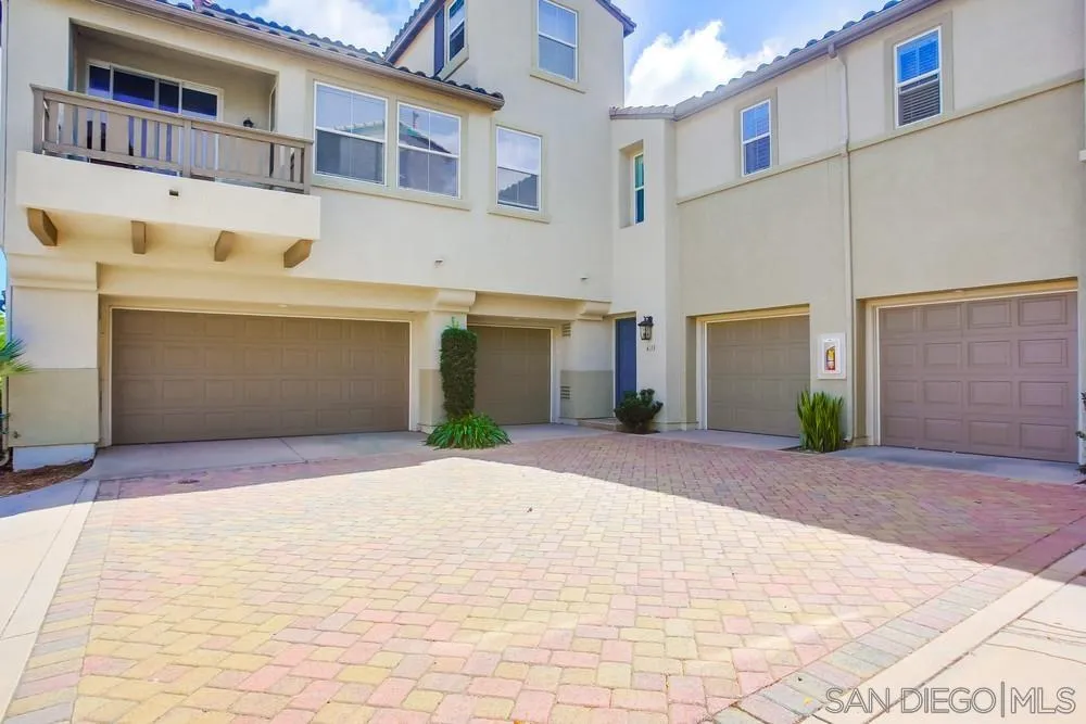 4115 Karst Road Carlsbad, CA 92010 - Photo 43 of 43 a front view of a building with a yard and garage