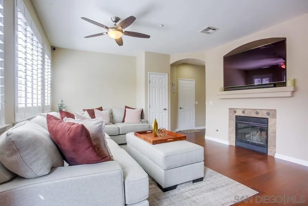 4115 Karst Road Carlsbad, CA 92010 - Photo 10 of 43 a living room with furniture and a fireplace