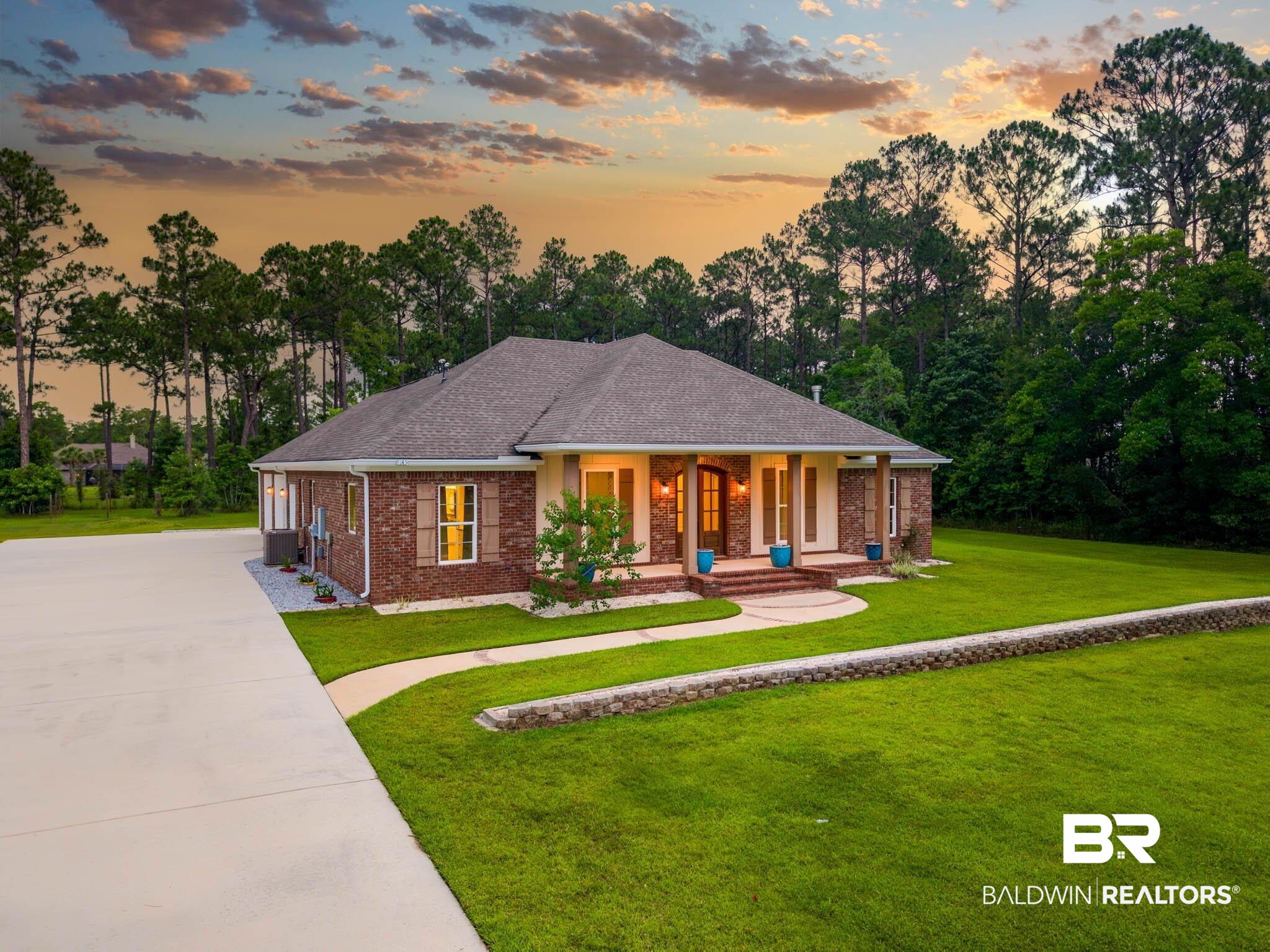 8145 Bay View Drive Foley, AL 36535 - Photo 62 of 81 Ranch-style house featuring covered porch, brick siding, a yard, roof with shingles, and driveway