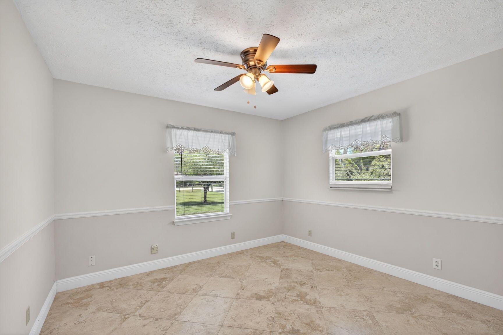 12558 165th Road North Jupiter, FL 33478 - Photo 30 of 67 a view of an empty room with a window