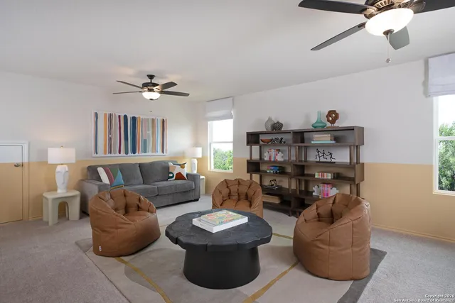 a bedroom with furniture and a window