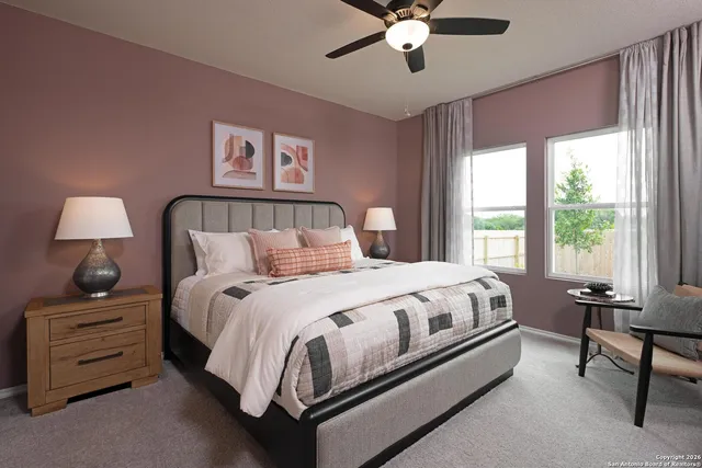 a en suite bathroom with double sink and a mirror