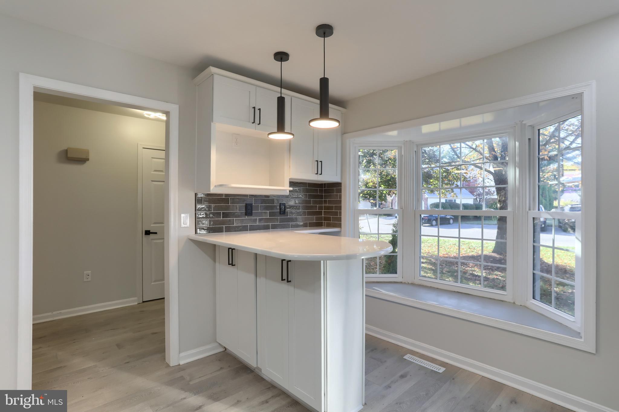 2065 Raleigh Road, Unit B Hummelstown, PA 17036 - Photo 11 of 40 a view of kitchen with granite countertop stove and large window