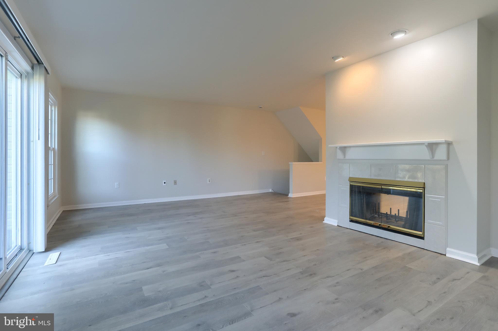 2065 Raleigh Road, Unit B Hummelstown, PA 17036 - Photo 19 of 40 an empty room with a fireplace and window