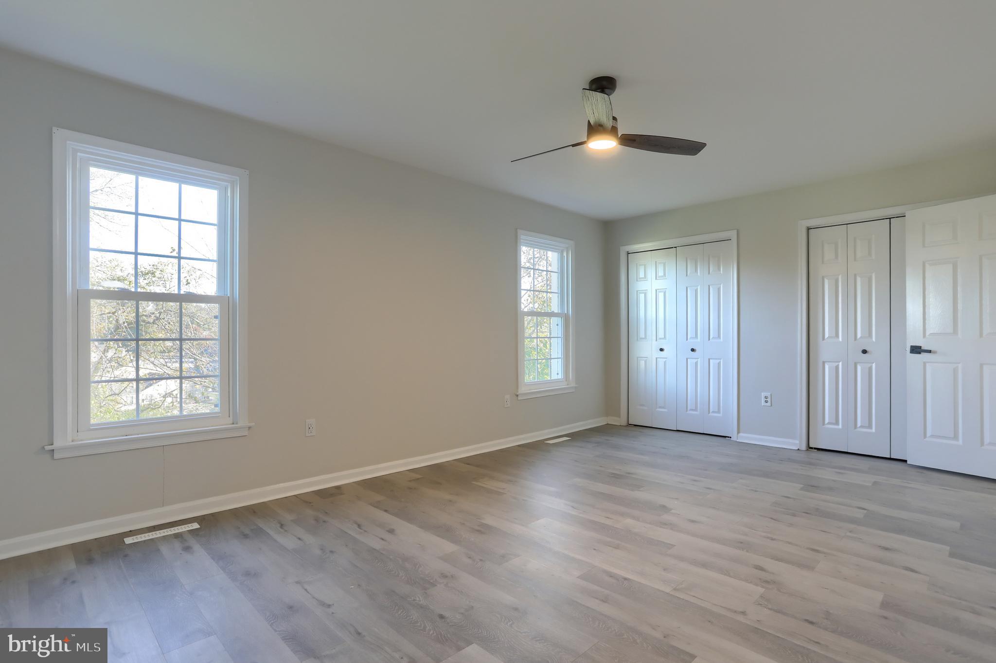 2065 Raleigh Road, Unit B Hummelstown, PA 17036 - Photo 24 of 40 a view of an empty room with wooden floor and a window