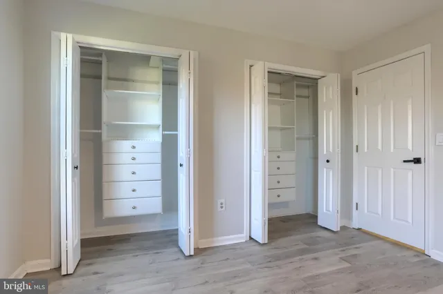 an empty room with closet area