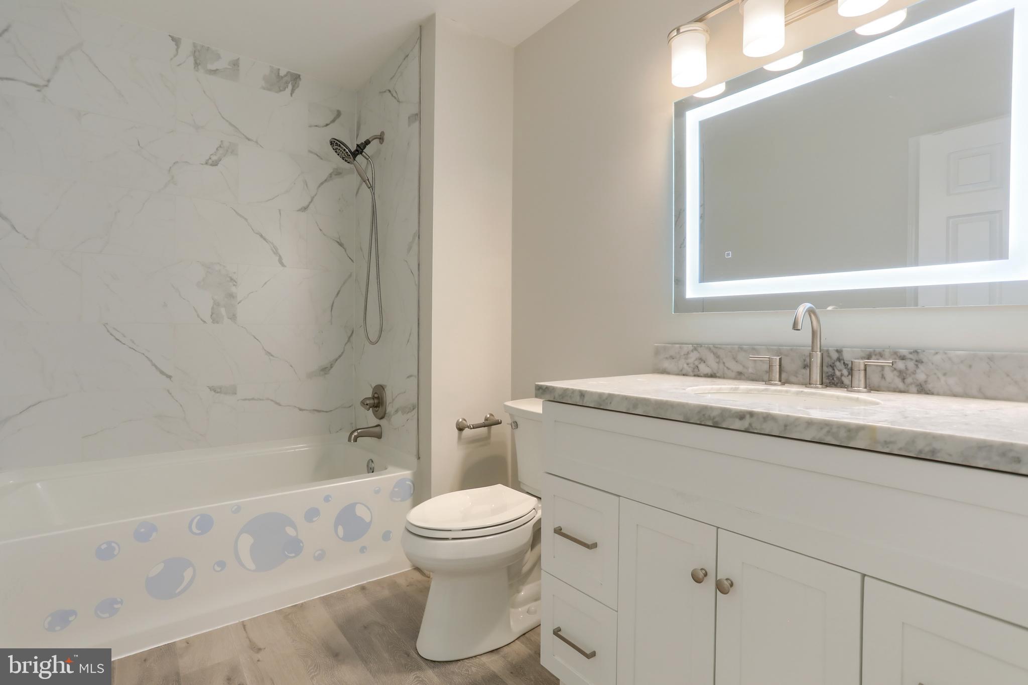2065 Raleigh Road, Unit B Hummelstown, PA 17036 - Photo 30 of 40 a bathroom with a granite countertop sink toilet and shower