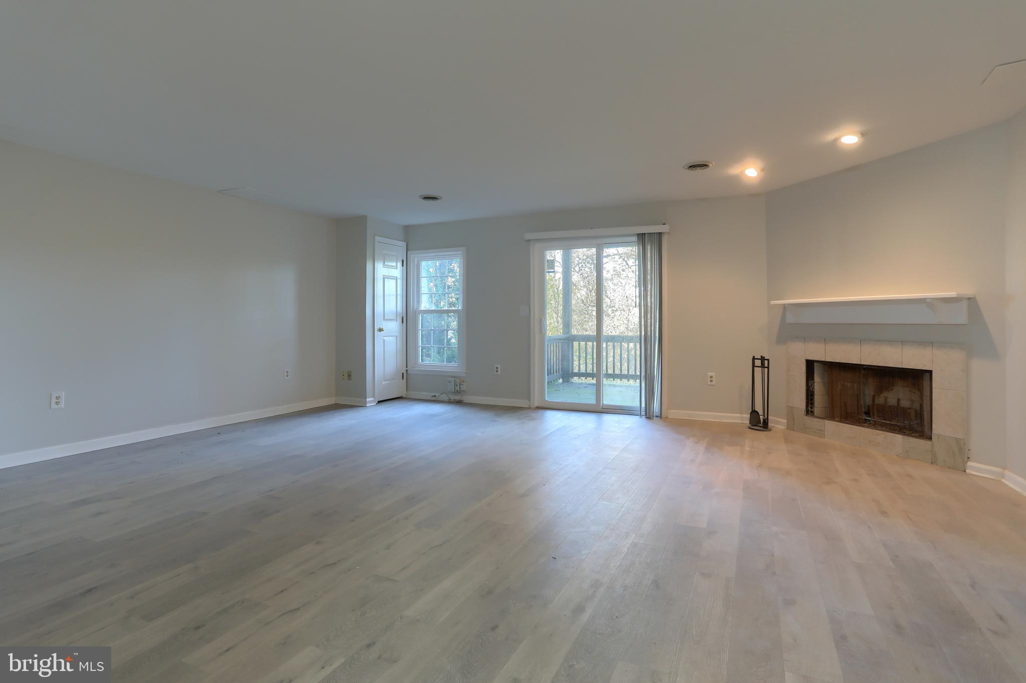 2065 Raleigh Road, Unit B Hummelstown, PA 17036 - Photo 31 of 40 an empty room with windows and fireplace