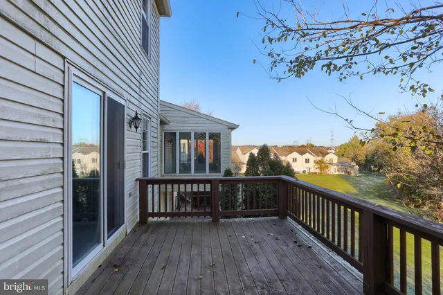 a view of balcony with wooden floor