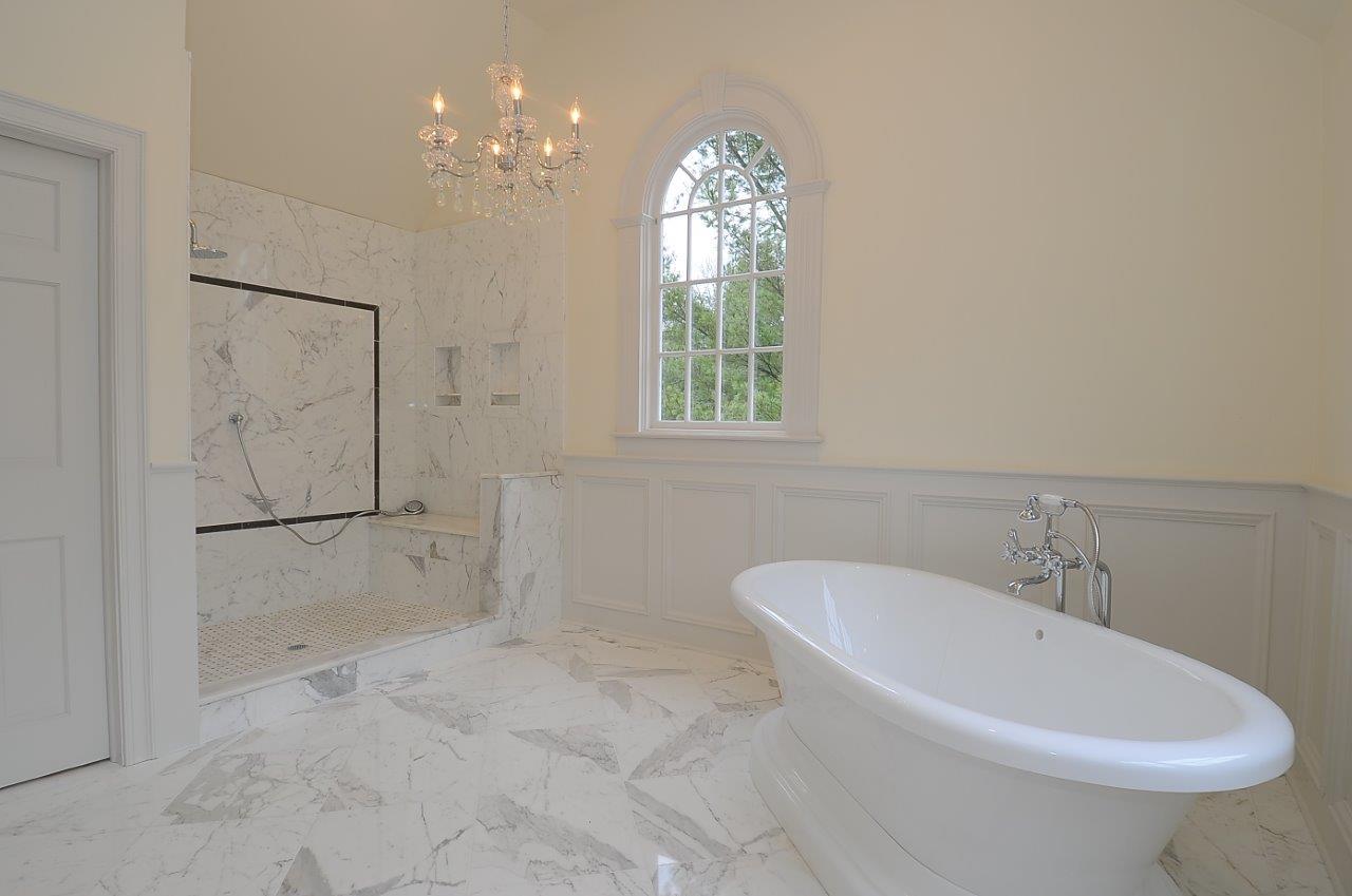 1185 Smith Ridge Road New Canaan, CT 06840 - Photo 11 of 17 a white bath tub sitting next to a white sink