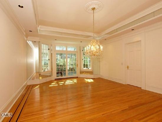 1185 Smith Ridge Road New Canaan, CT 06840 - Photo 13 of 17 a view of an empty room with window and wooden floor