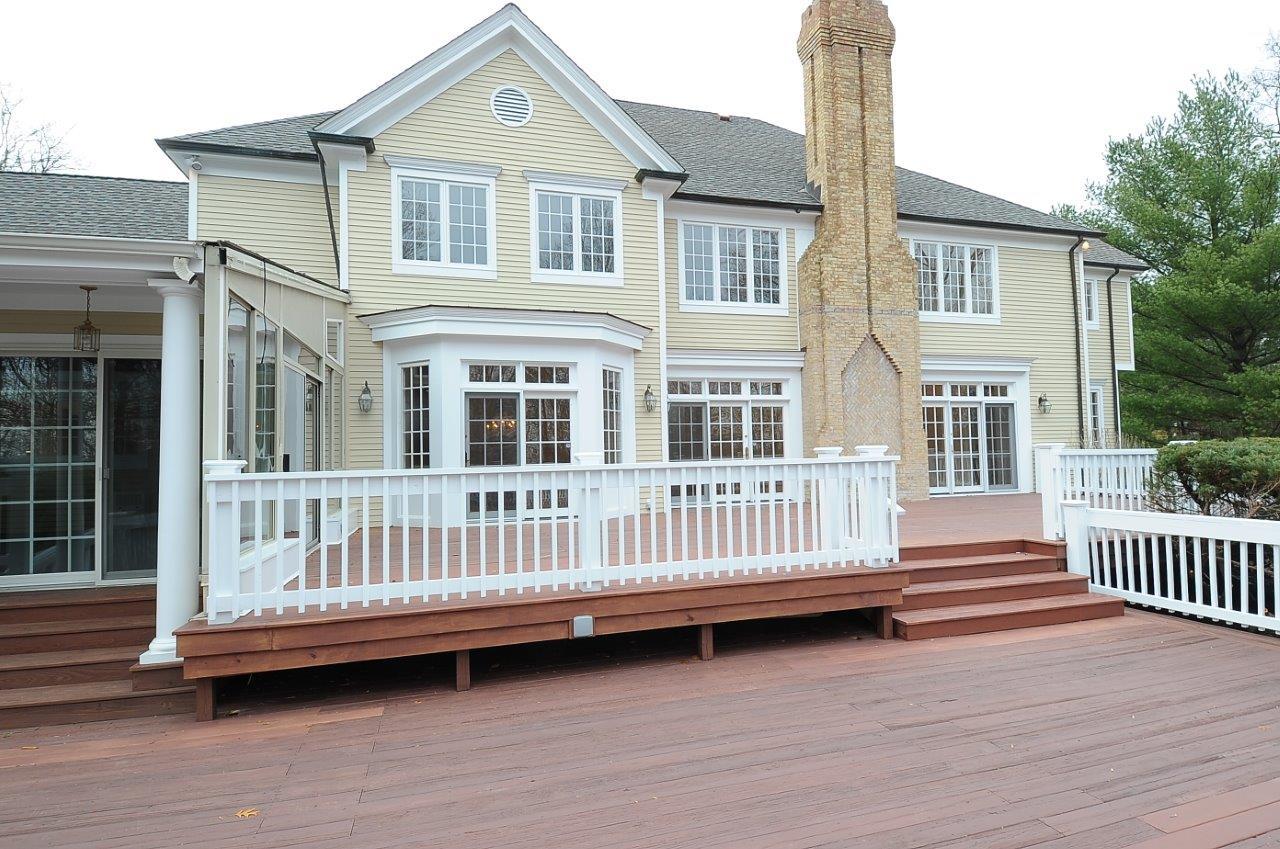 1185 Smith Ridge Road New Canaan, CT 06840 - Photo 15 of 17 a view of a house with a wooden deck