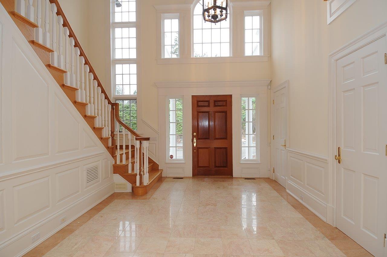 1185 Smith Ridge Road New Canaan, CT 06840 - Photo 2 of 17 a view of an entryway with staircase