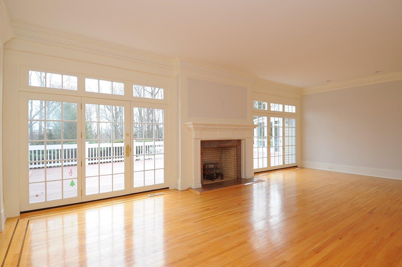 1185 Smith Ridge Road New Canaan, CT 06840 - Photo 4 of 17 a view of an empty room with a window and wooden floor