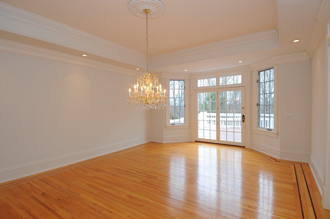 1185 Smith Ridge Road New Canaan, CT 06840 - Photo 6 of 17 a view of an empty room with wooden floor and a window