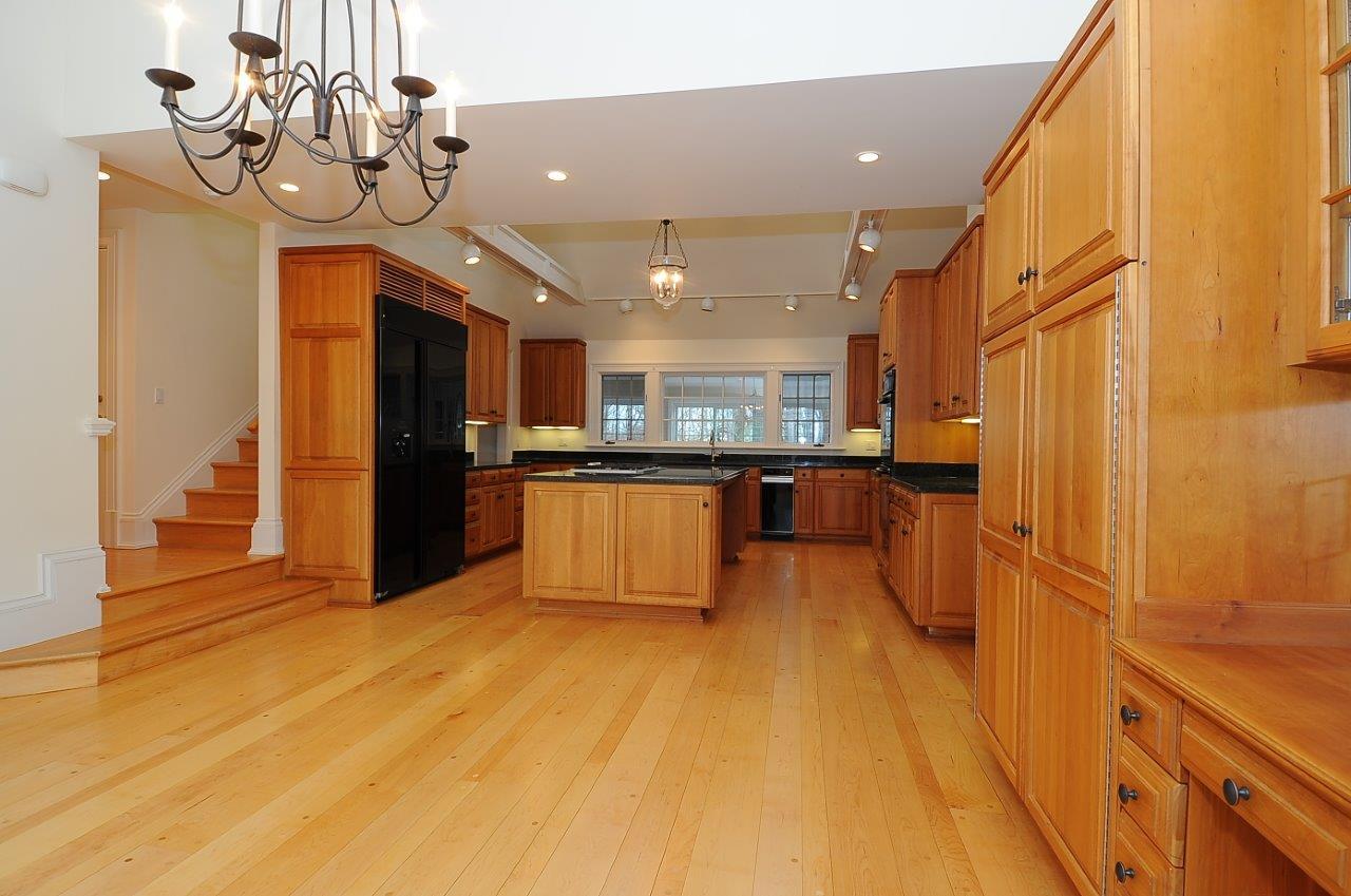 1185 Smith Ridge Road New Canaan, CT 06840 - Photo 7 of 17 a large kitchen with stainless steel appliances granite countertop a refrigerator and a sink