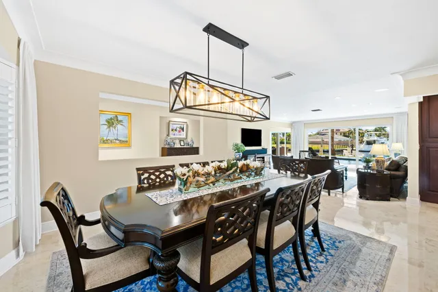 a kitchen with a table and chairs in it